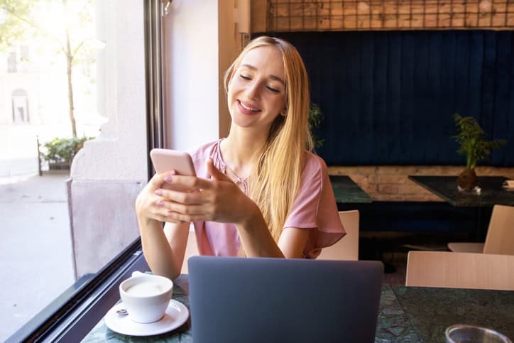 Young woman using her mobile phone.