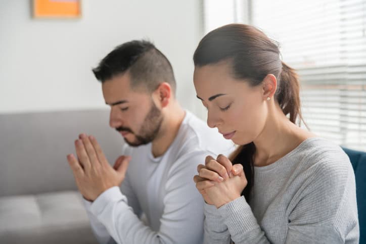 young couple praying