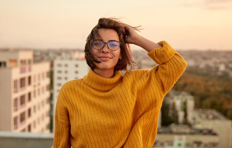 woman in orange jumper outside