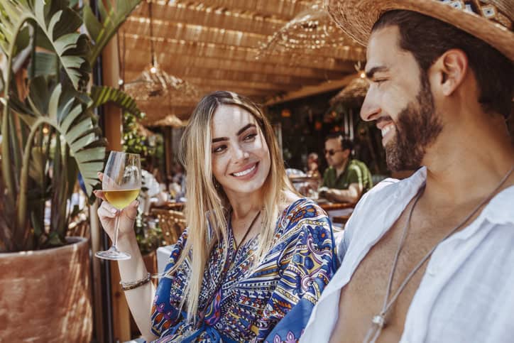 couple sitting in a bar talking