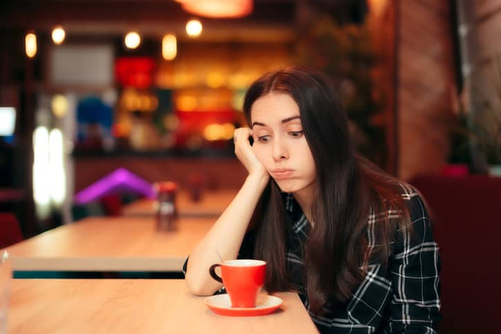 Bored Girl Waiting for Date in a Coffee Shop