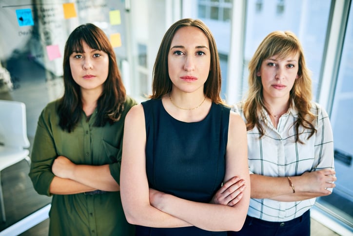 three women arms crossed