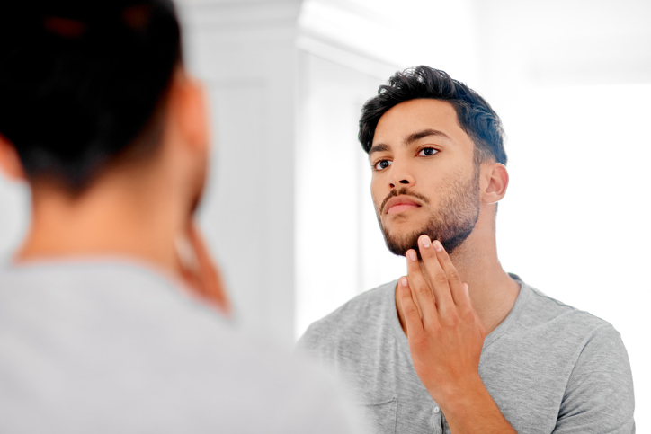 A narcissistic man looking in the mirror