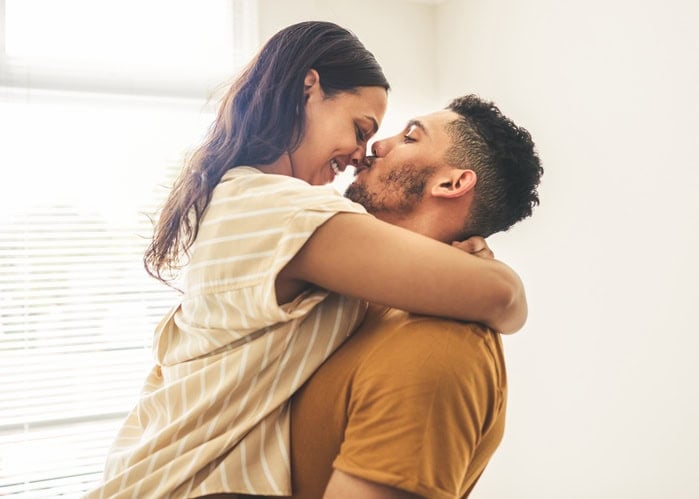 Happy couple hugging.