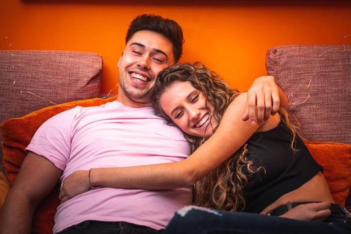 young happy smiling couple sitting