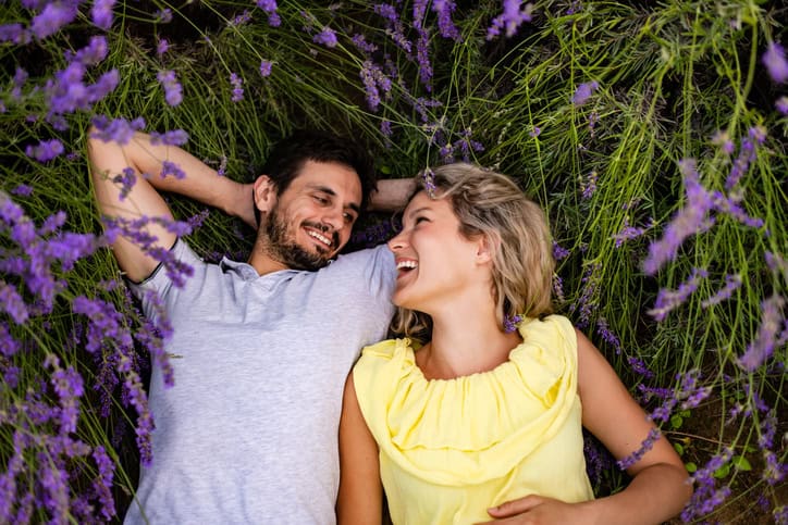 couple laying in the grass