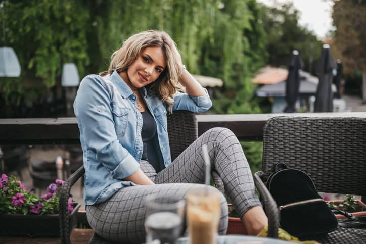 woman in denim jacket sitting down