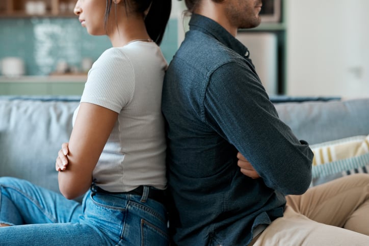 couple sitting back to back