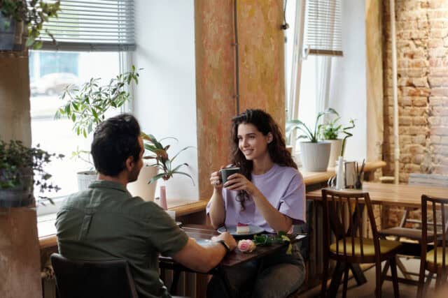 couple on a first date at coffee shop