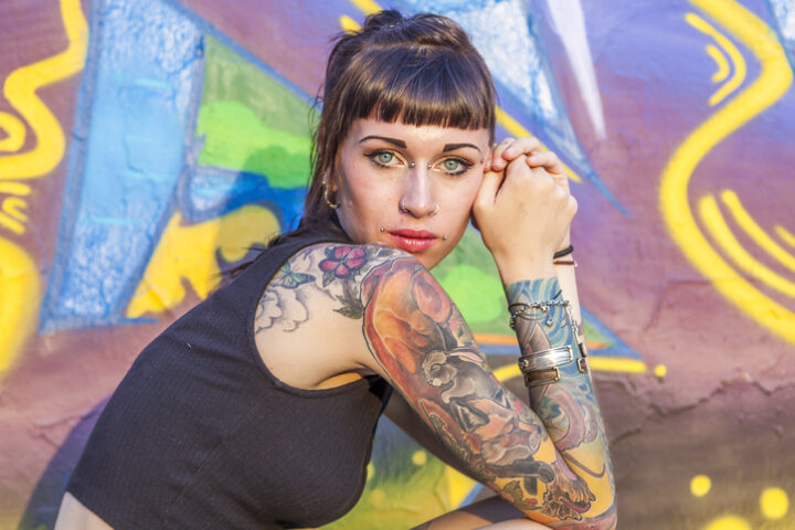 happy single woman with tattoos