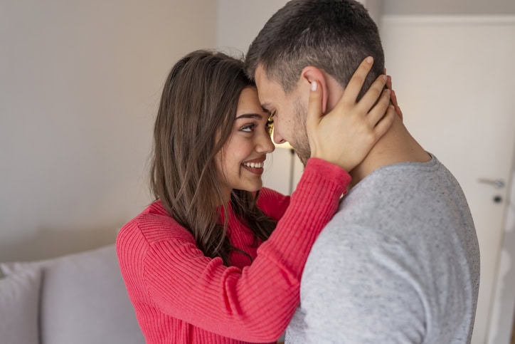 happy couple embracing closely