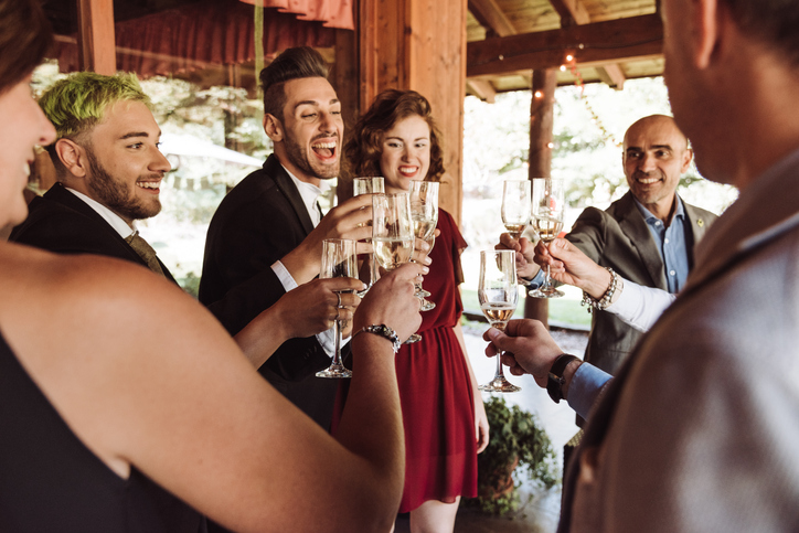 Couple celebrating engagement at party.