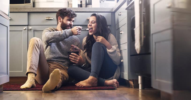 couple eating ice cream kitchen