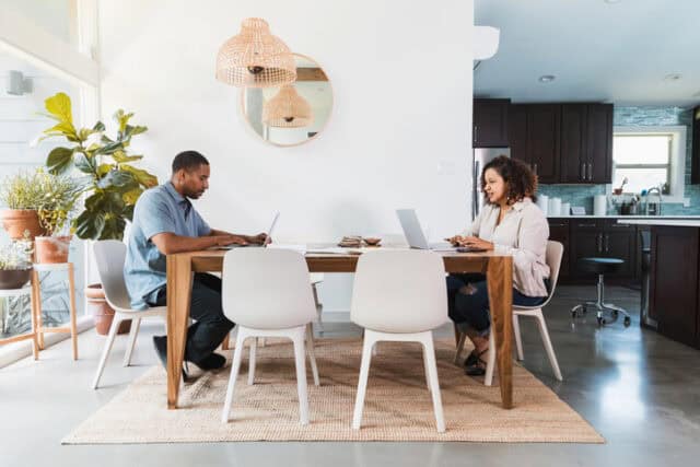 couple working at dining table