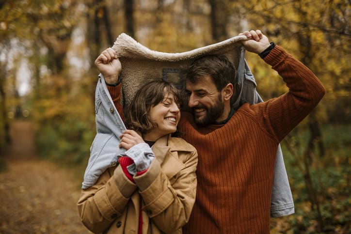 couple walking in autumn forest
