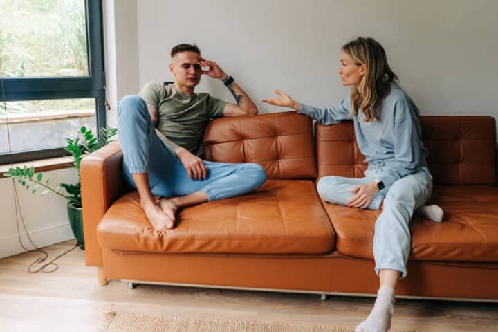couple arguing on couch