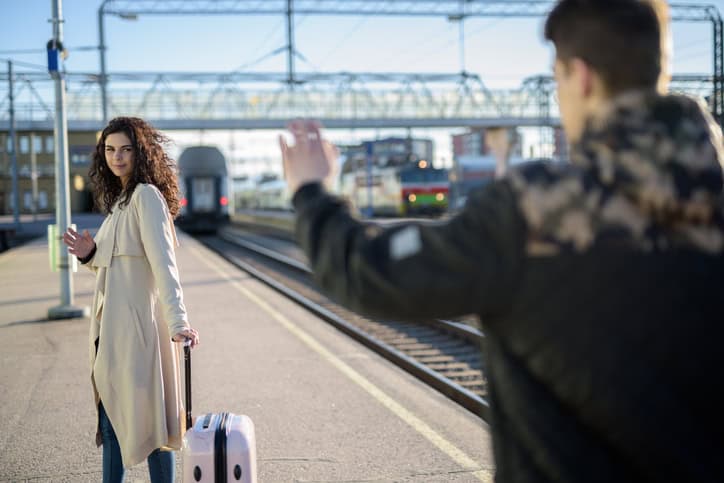 couple separating at train station