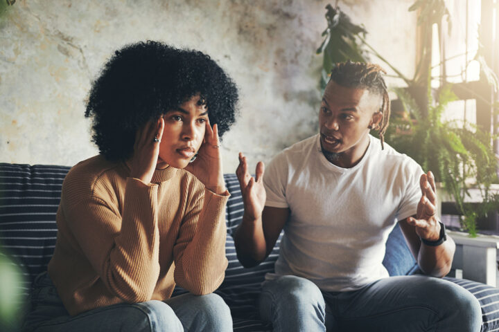 boyfriend shouting at frustrated girlfriend