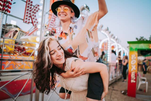 friends having fun at amusement park