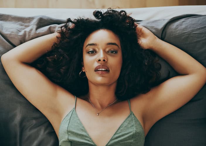 sexy black woman in bed