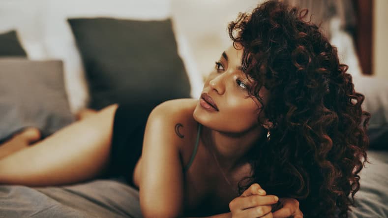sexy woman laying in bed