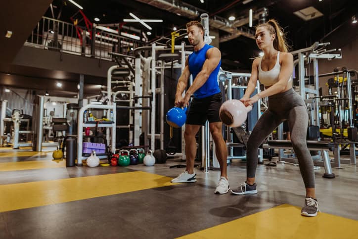 Couple working out at the gym.