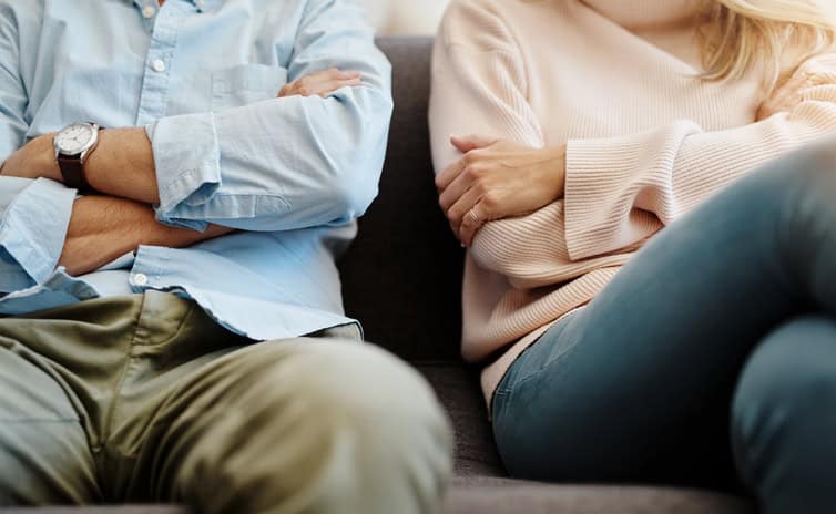 couple with arms crossed