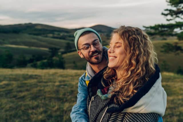 couple hanging out outdoors on an autumn day