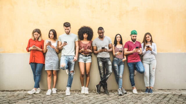 group of gen z on smartphones