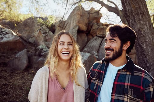 happy couple smiling outdoors