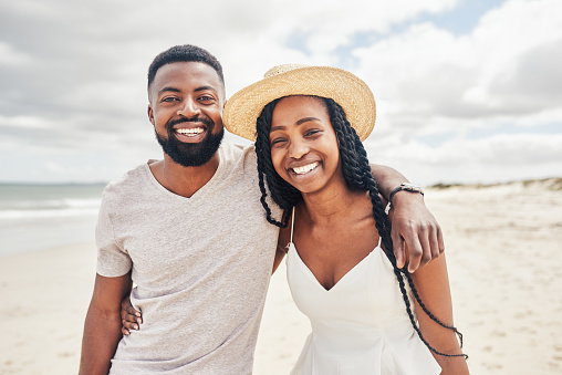 Portrait of an affectionate young couple enjoying their date at the beach