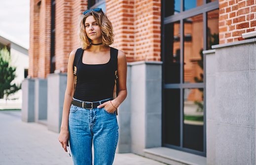Young woman standing on the street.