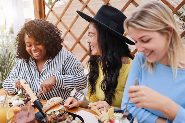female friends enjoying brunch outdoors