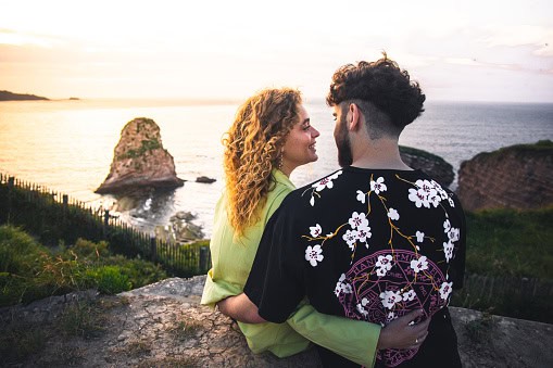 Couple embracing at the beach.