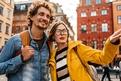 Tourist couple on the street in Stockholm, Sweden.