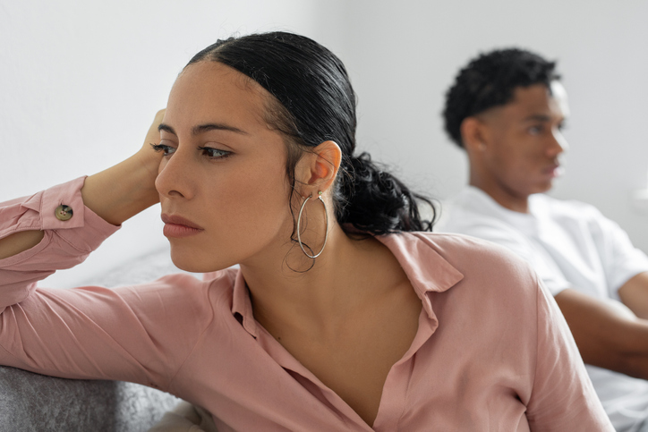 upset couple on couch after fight
