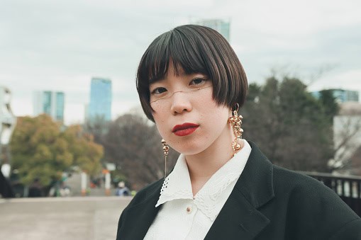 serious looking woman in city