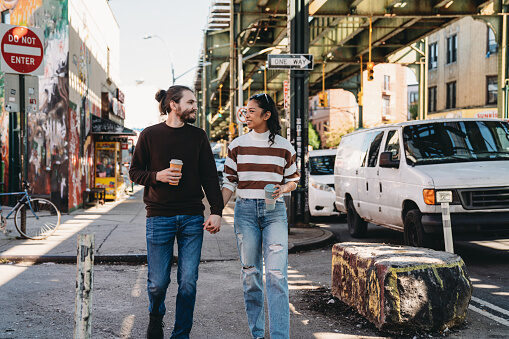 couple walking down street chatting