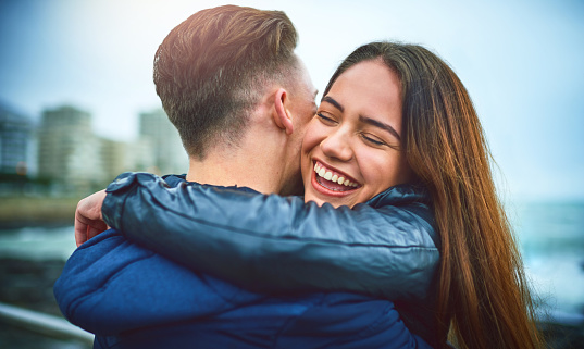 happy woman hugging her boyfriend