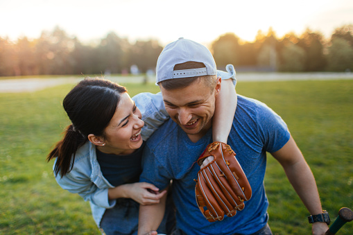 couple playing baseball together