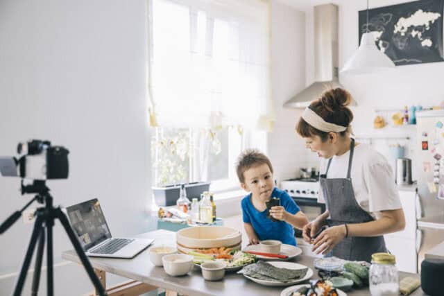 mom and son vlogging in kitchen