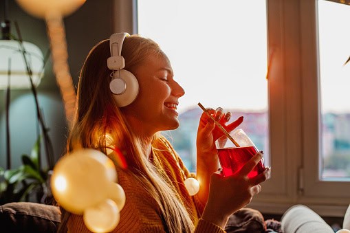 Young woman listening with headphones.