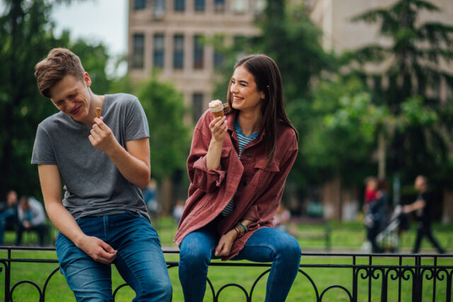 laughing couple eating ice cream