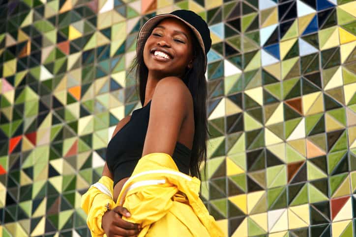 Vibrant woman smiling outdoors.
