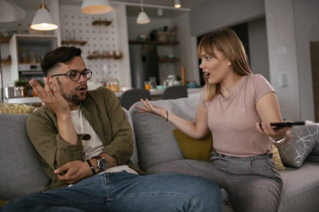 couple arguing on couch