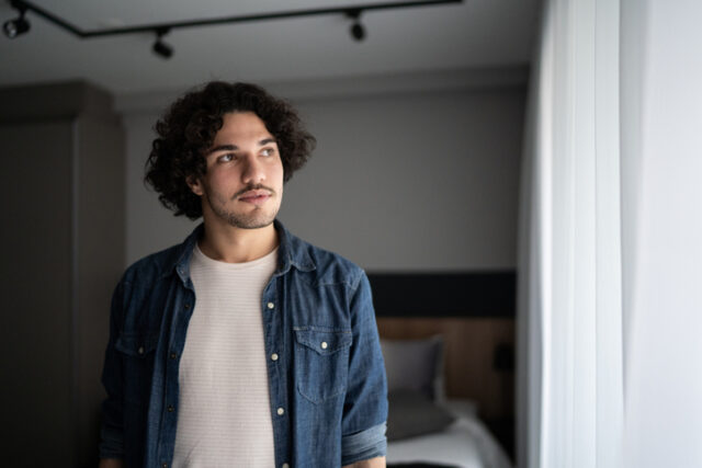contemplative man at home