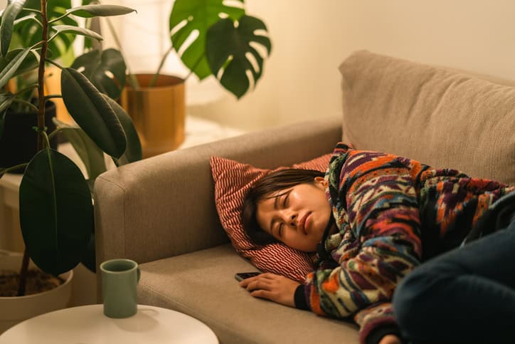 woman taking a nap on couch