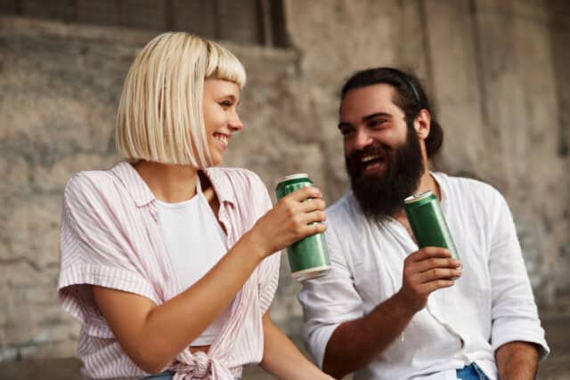 happy man woman friends drinking beer