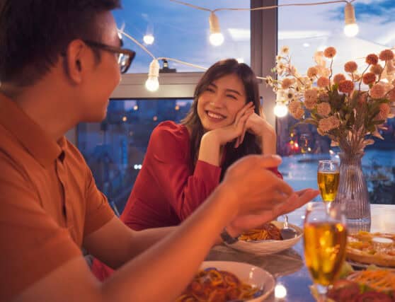 smiling couple on dinner date together