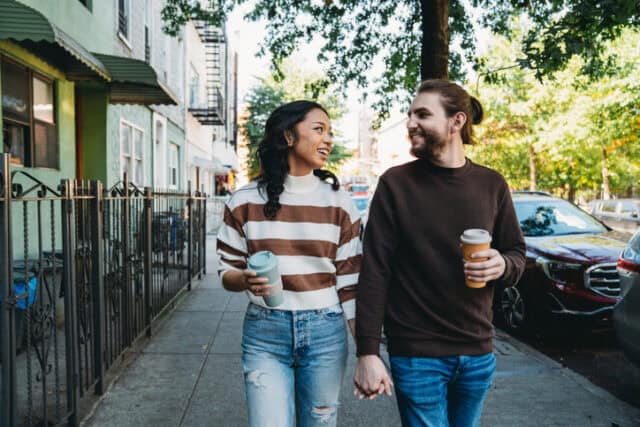 couple walking hand-in-hand brooklyn